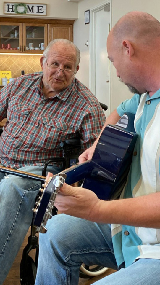 Proveer Senior Living | Matthew singing with resident