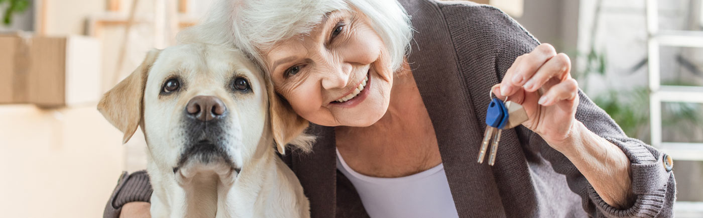 Proveer at Grande View | Senior woman holding keys next to dog